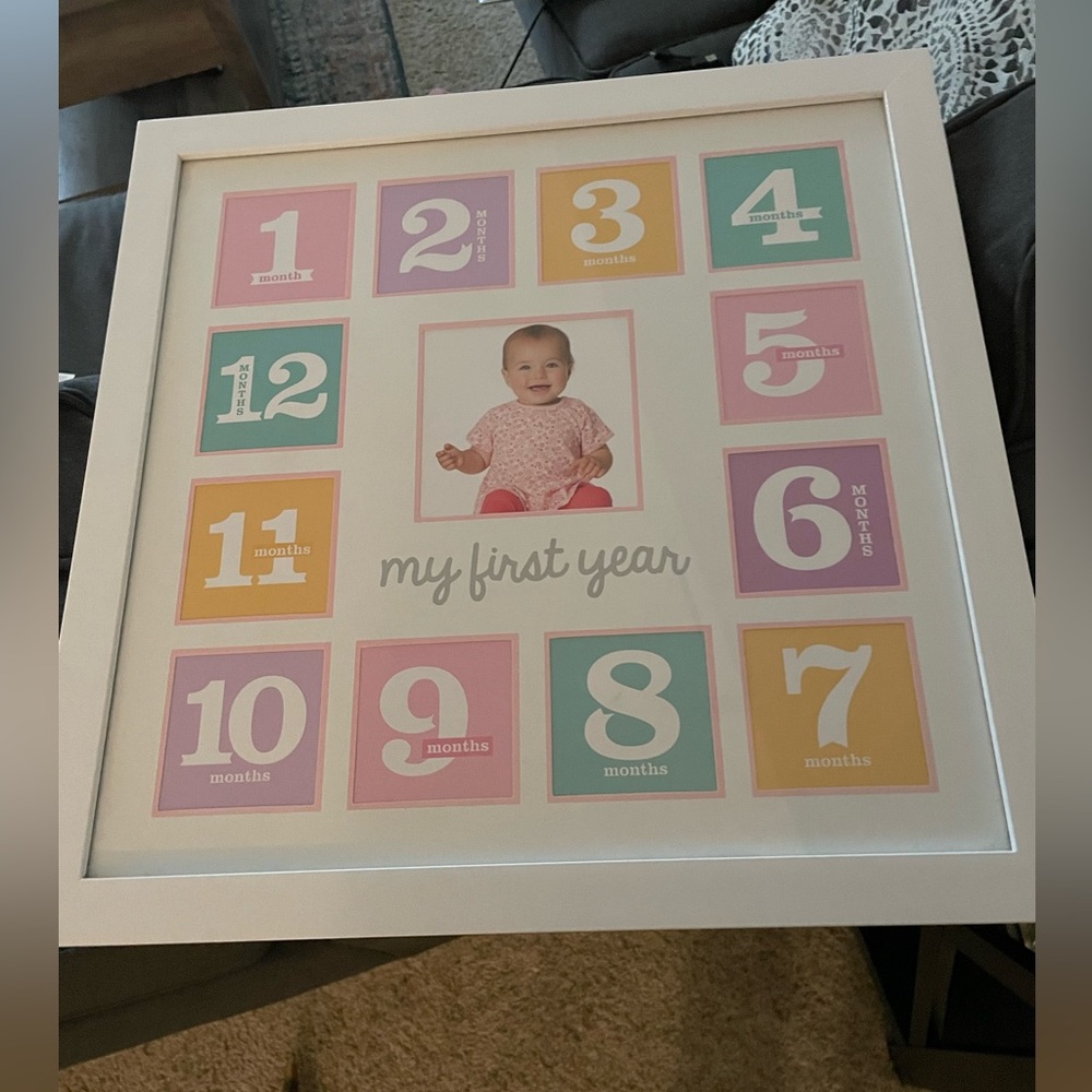 White “My first year” collage frame for infant photos. Girl infant - pink